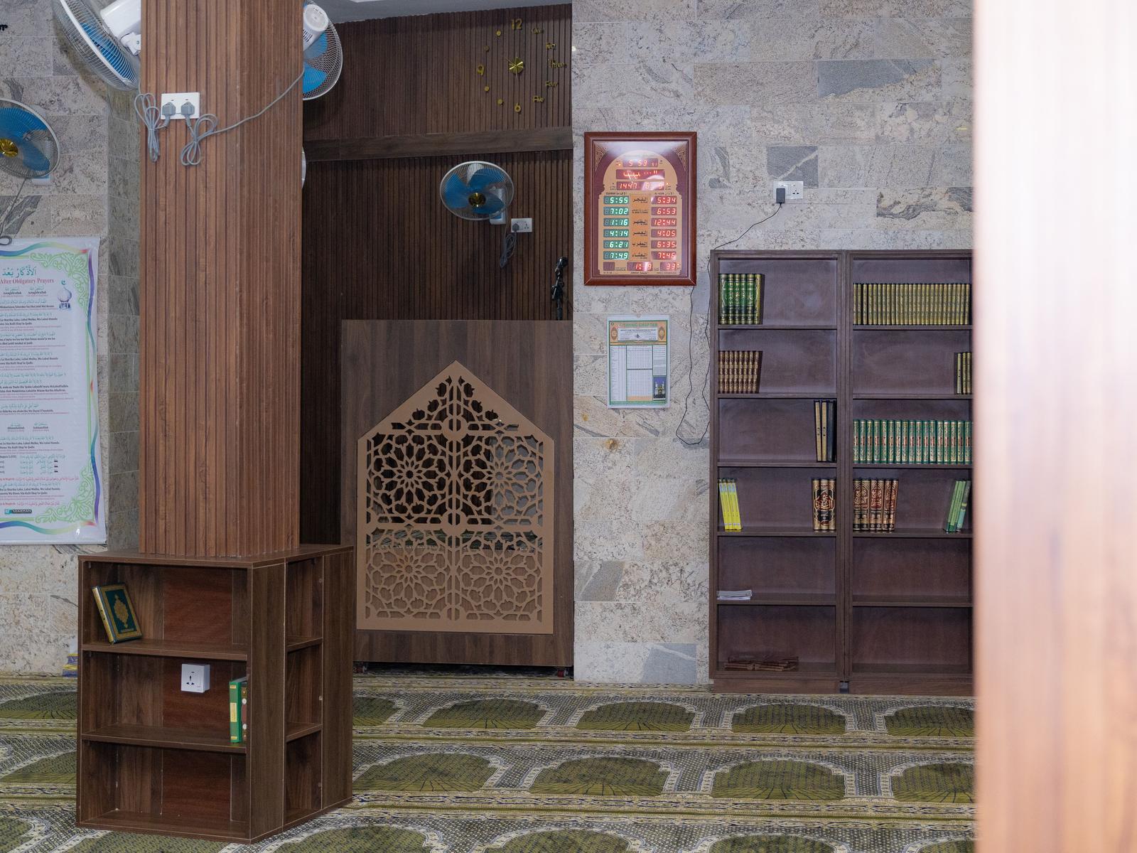 Digital iqamah board and Quran library inside the masjid